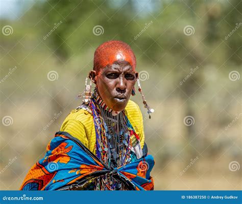 Portrait Of A Masai Tribe Young Woman In Traditional Dress Close Up