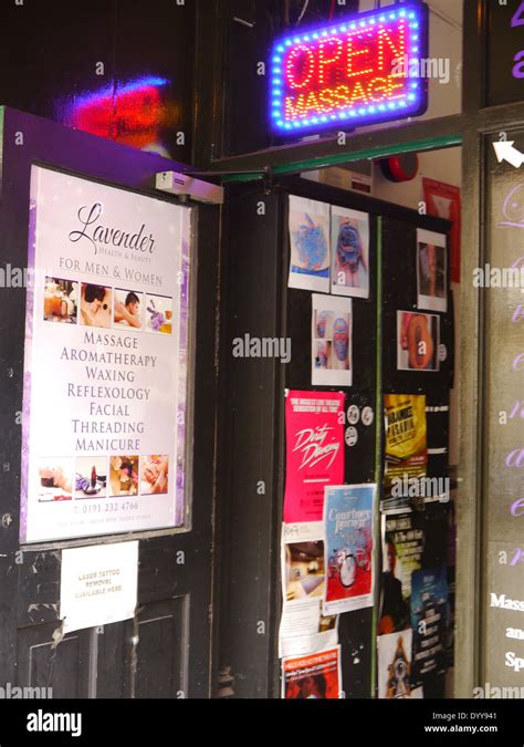 Massage Parlour Doorway With Neon Sign And Bill Posters Advertisments