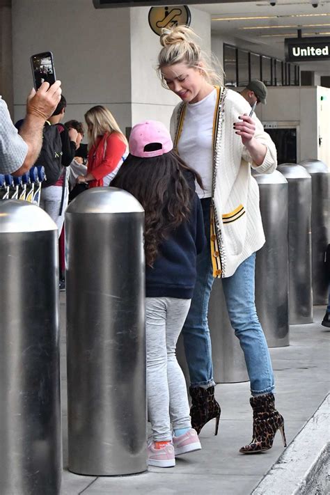 Amber Heard Greets Her Fans As She Touches Down At Lax In Los Angeles