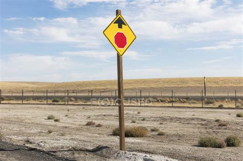 Stop Sign Ahead A Yellow Sign And Red Circle With Arrow Roadside