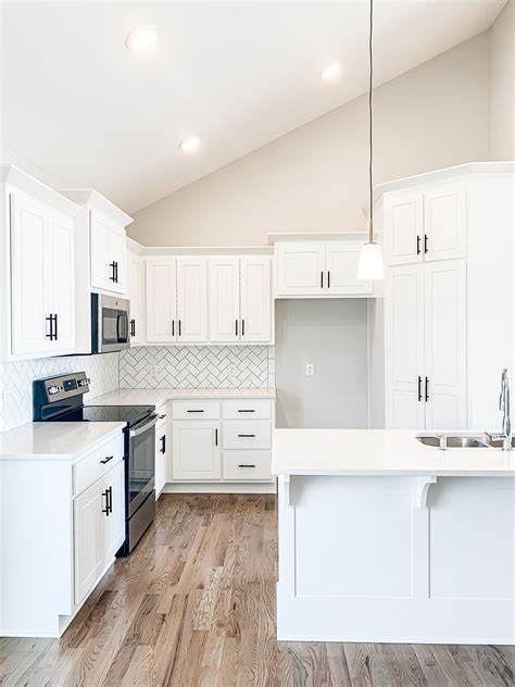 Beautiful White Kitchen Cabinets With Black Hardware And Hardwood