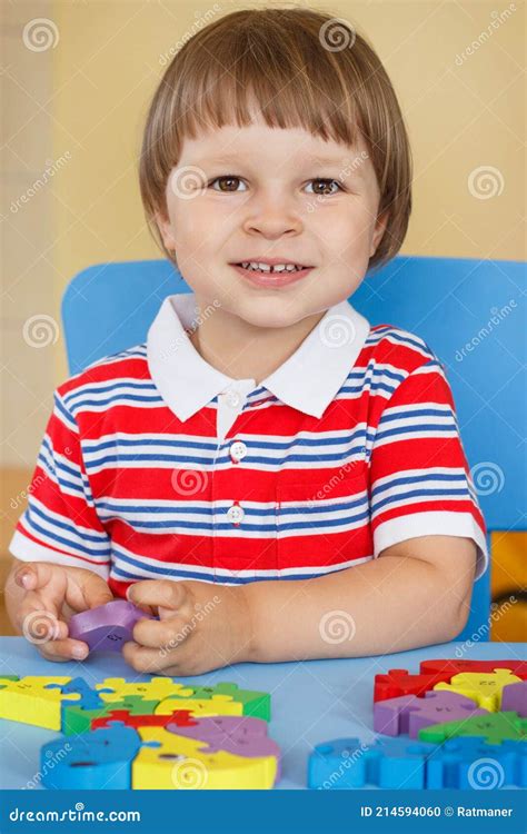 Happy Preschooler Playing With Puzzle Child Development Concept Stock