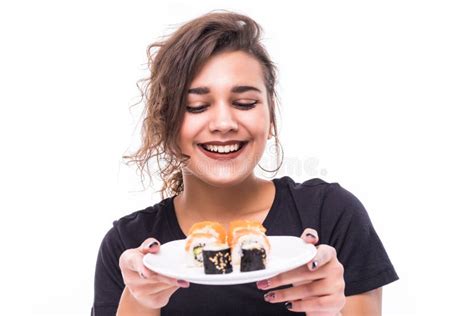 Young Girl Holding Plate Of Sushi In Her Hands Isolated On White