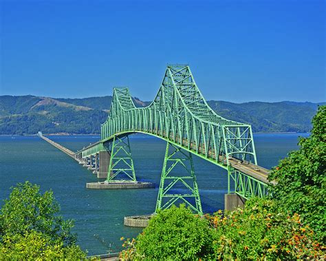 The bridge's main span is 1,232 feet in length, the longest continuous truss in the nation. Astoria Megler Bridge Photograph by Jack Moskovita