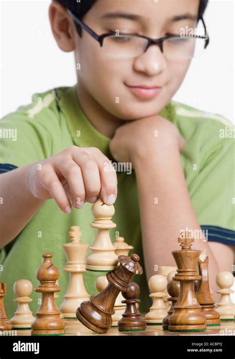 Close Up Of A Boy Playing Chess Stock Photo Alamy