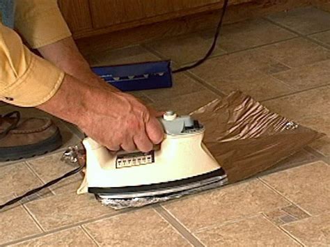 Use a caulk gun to apply the silicon to the wood. How to Fix Curling Vinyl Floor Tile | how-tos | DIY