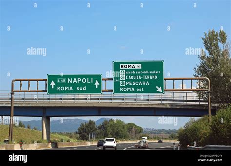 Italian Road Sign On Motorway Near Rome City And The Arrows Directions
