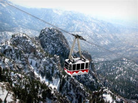 Sandia Tram Above The Snowy Peaks Photograph By Aaron Burrows Fine