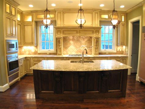 To create balance, complementing white polished ceramic tiles are used for the flooring while satin stainless steel appliances serve as subtle accents. 24 Most Creative Kitchen Island Ideas -DesignBump