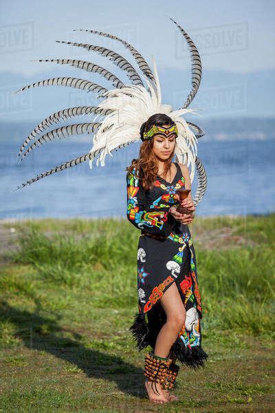 Native American Woman In Traditional Headdress Performing Ceremony