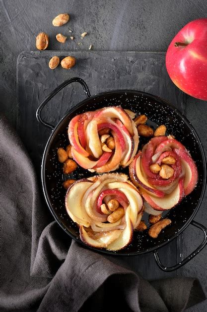 Premium Photo Three Puff Pastries With Rose Shaped Apple Slices Baked