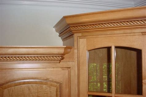For any cabinets with an inside corner, cut the miters with the opposite 45 degree angle so that the miter angles on the crown molding cuts into itself. Crown Molding On Cabinets - Carpentry - DIY Chatroom Home ...