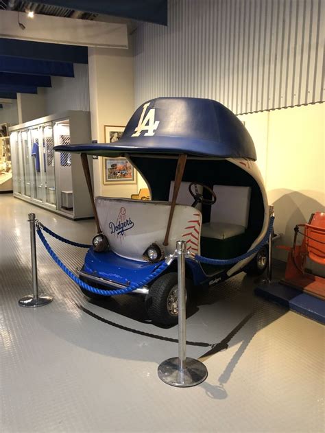 A Baseball Themed Boat Is On Display In A Museum Exhibit With Ropes