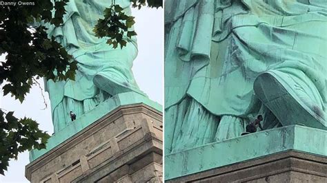 Woman Climbs Statue Of Liberty Liberty Island Evacuated