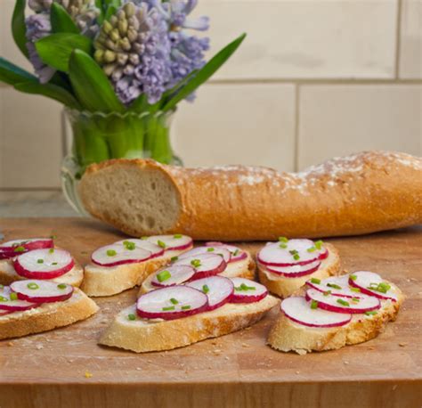 Sliced Baguette With Butter Radishes And Sea Salt