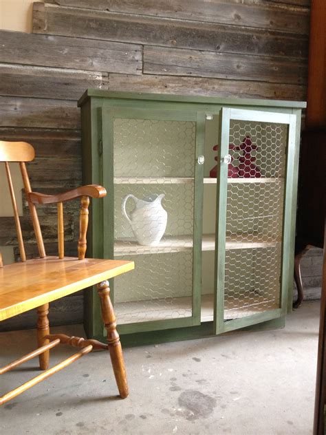 Chippy Farmhouse Cabinet With Chicken Wire Doors Painted By Dacha House