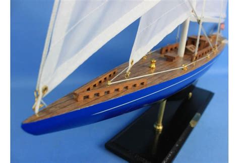 Beach house decorating with model sailboats and decorative wooden oars. Velsheda Wooden Sailboat Model Decoration
