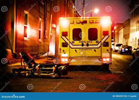 An Ambulance Car Parked On The Side Street At Night Stock Photo Image