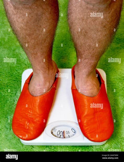 Hairy Legs Orange Slippers Stock Photo Alamy