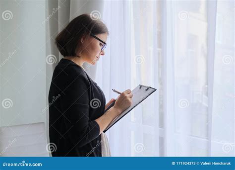 mature woman doctor social worker psychologist taking notes stock image image of mature