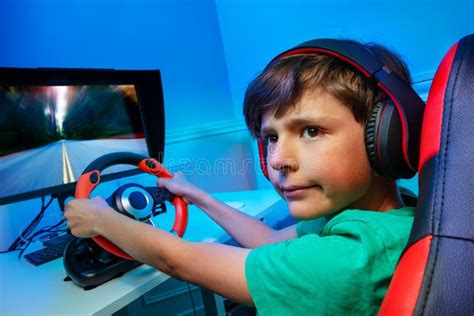 Boy With Steering Wheel Play Race Game Turn And Look Back Stock Image