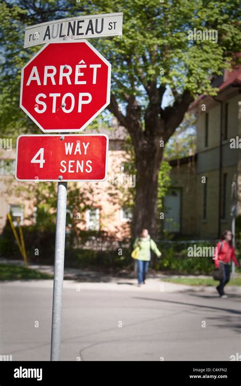 A French English Bilingual Stop Sign Is Seen On Rue Aulneau Street In