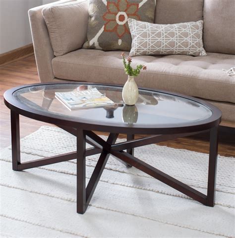 This Striking Glass Top Oval Coffee Table Is Sure To Be A Conversation