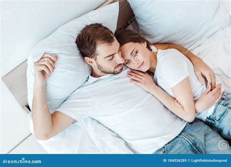 View Of Man Embracing Wife While Sleeping On Bed Stock Image Image Of Love Adult 184036289