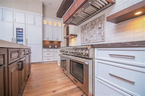 This Newly Renovated Kitchen With Stone Tile Subway Tile And Custom