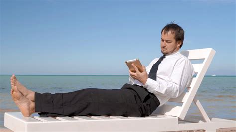 Young Businessman Is Working On The Beach Male Professional Is Sitting