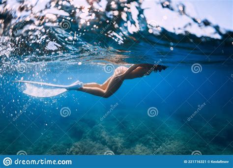 Naked Slim Woman With Freediving Fins Swimming In Blue Ocean Stock Image Image Of Bikini