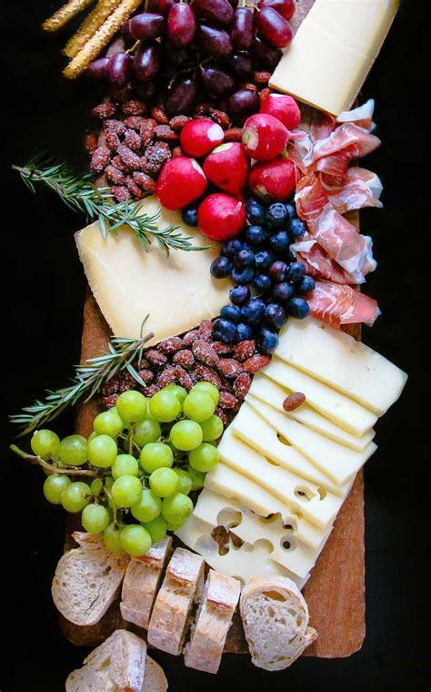 Enjoy your favorite patriotic colors in a delightful cheeseboard with a special summer treat for dessert! How To Make The Perfect Cheese Board. - Layers of Happiness