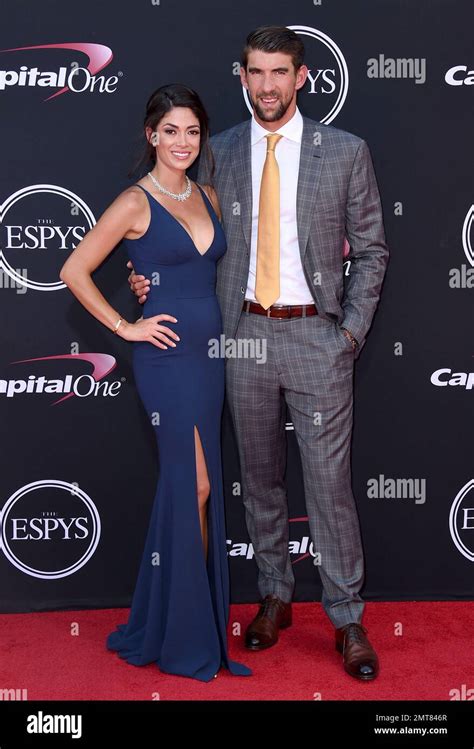 nicole johnson left and michael phelps arrive at the espys at the microsoft theater on