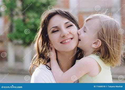 Portrait Young Mother With Her Daughter On The Nature Stock Photo