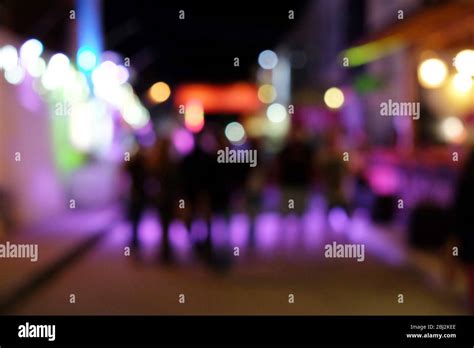 People Walking On Entertainment Street In The Evening Unfocused Stock