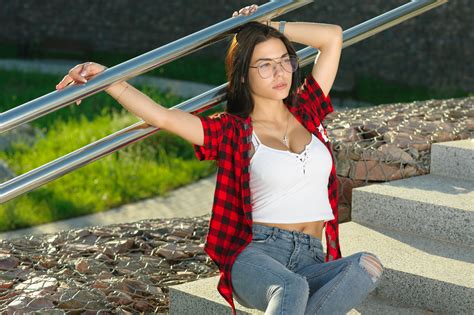 women sitting women with glasses marina shimkovich portrait plaid shirt torn jeans stairs