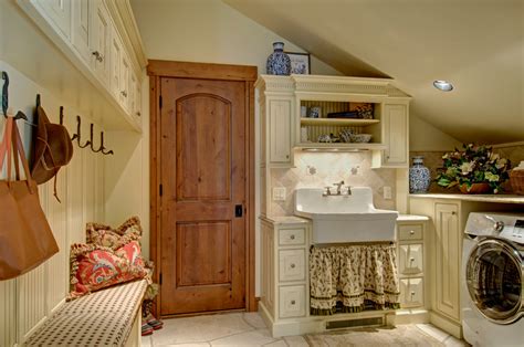 Amazing gallery of interior design and decorating ideas of laundry room farmhouse sink in laundry/mudrooms, bathrooms by elite interior windows framed by gray glazed grid wall tiles are located over a farmhouse laundry sink matched with an aged brass vintage faucet fixed over beige. Laundry/Mudroom storage with farm sink - Farmhouse ...