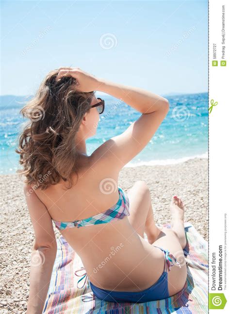 Woman Relaxing At The Beach Watching The Sea Stock Image Image Of