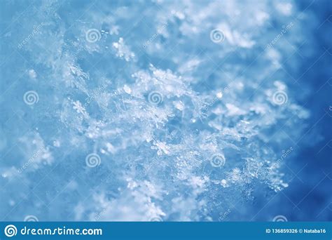 Natural Snow Background From Many Crystals Of Snowflakes Of Various