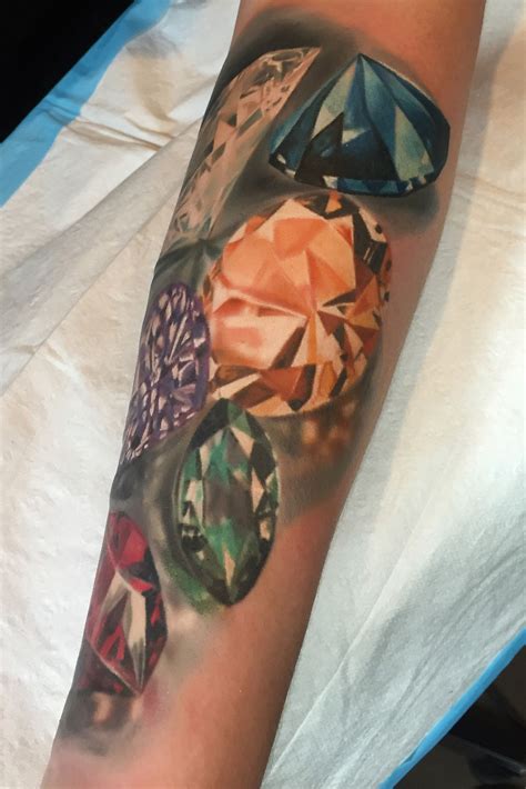 Realistic gems tattoo by Monte Livingston at Living Art Gallery Tattoo