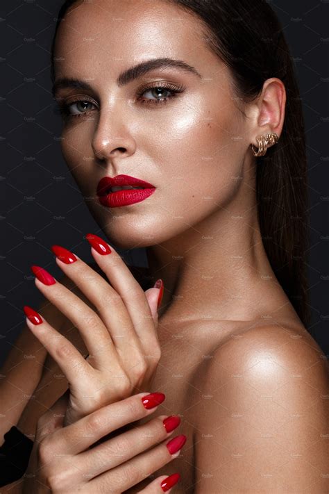 beautiful girl with red nails featuring beauty nails and make up beauty and fashion stock