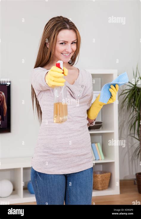 Portrait Of Young Woman Doing Household Chores Stock Photo Alamy
