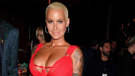 Amber Rose Shows Lots Of Skin And Flaunts Her Figure In Revealing Red