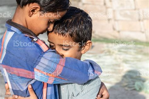 Orphan Children Comforting Each Other In The Time Of Crisis Stock Photo