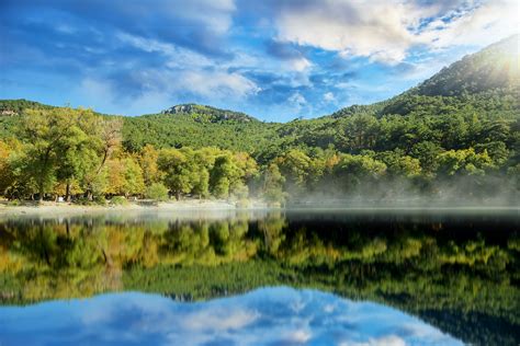 Calm Lake By Green Mountains · Free Stock Photo