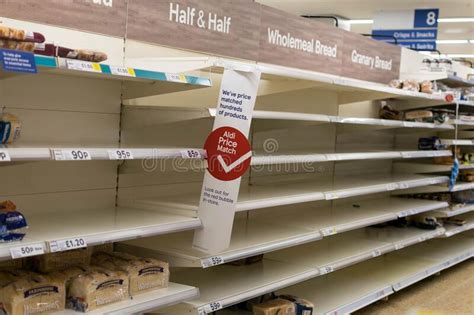 Rows Of Empty Shelves In Tesco Supermarket Store In
