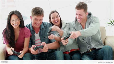 Friends Playing Video Games While Laughing Banco De Vídeos 3898562