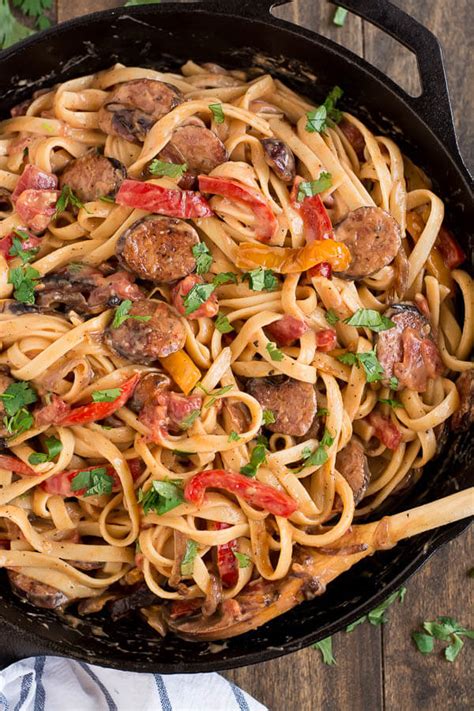 In a skillet, brown sausage in oil for 3 to 4 minutes. Creamy Cajun Pasta with Smoked Sausage - Oh Sweet Basil