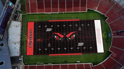 Football fields have an overall width of 53.3 yards (160' | 48.8 m). Cincinnati paints their football field and it's ...