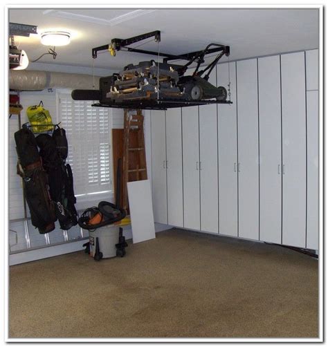 You need a mower lift to perform several assembling, repairing and cleaning tasks with your lawn mower. Lawn Mower Storage Lift. Yes! | Garage storage solutions ...